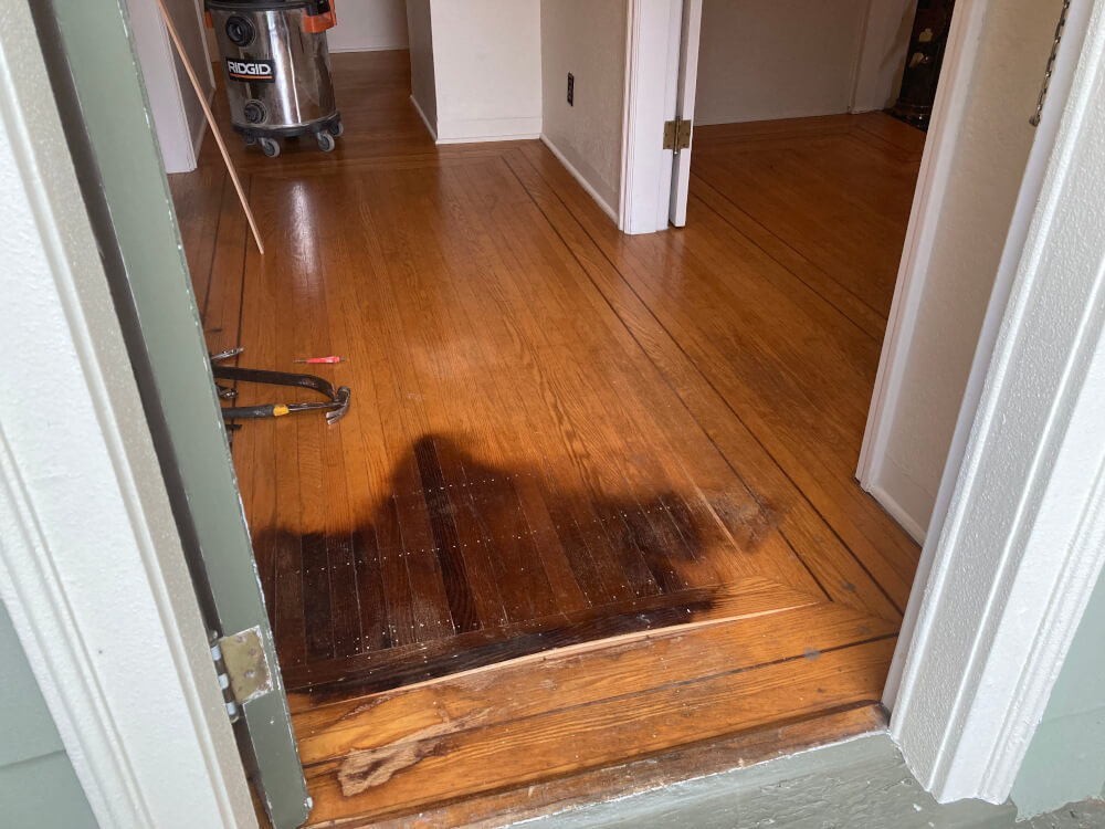hardwood floor in need of repair